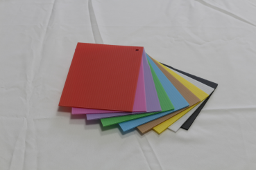 Corrugated plastic sheet for packaging and signage