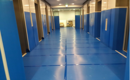 Corrugated plastic floor protection on construction site